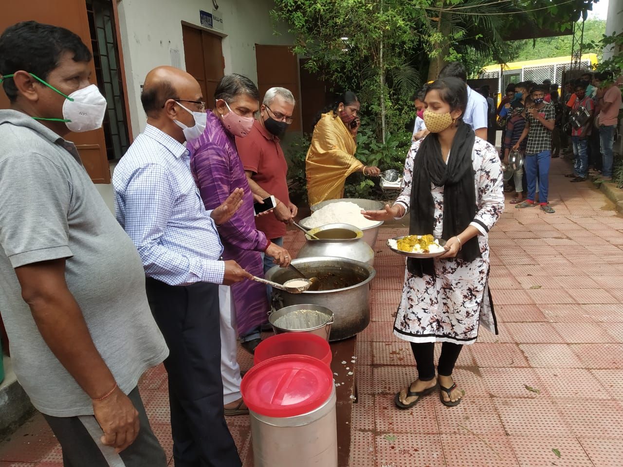 Members serving food during a seva drive