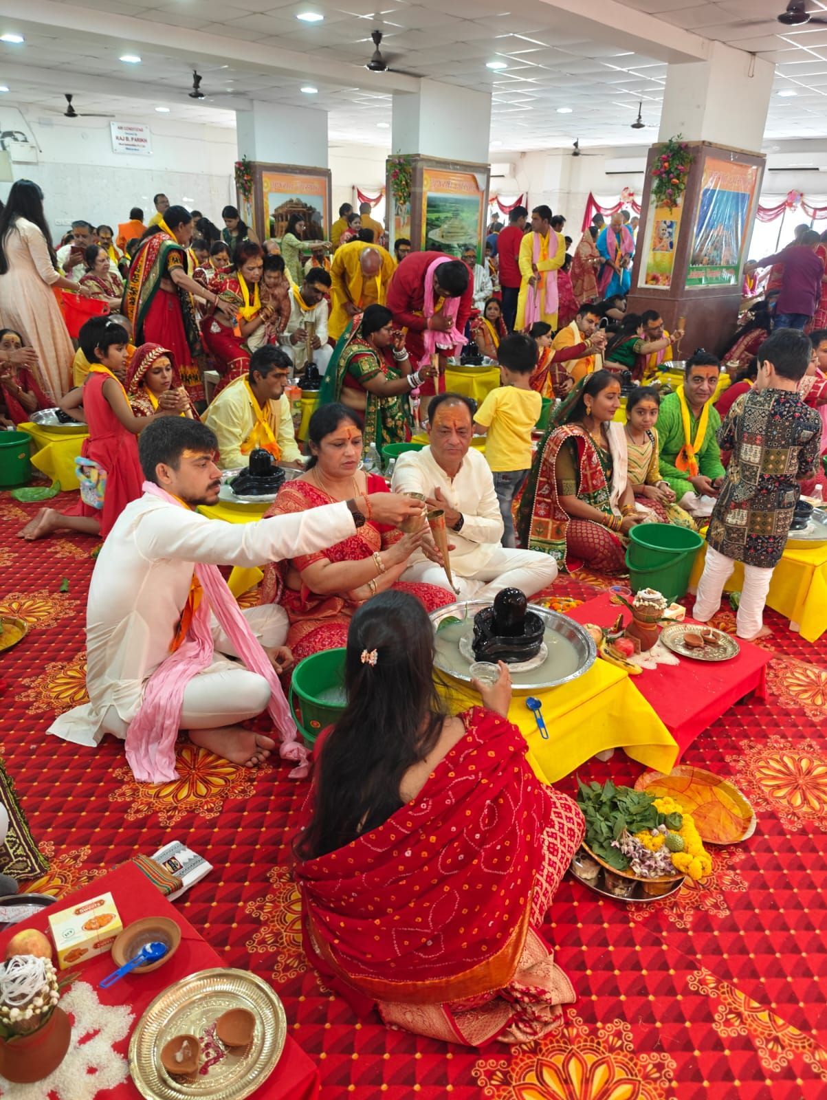 Families performing Rudra Abhishek Puja